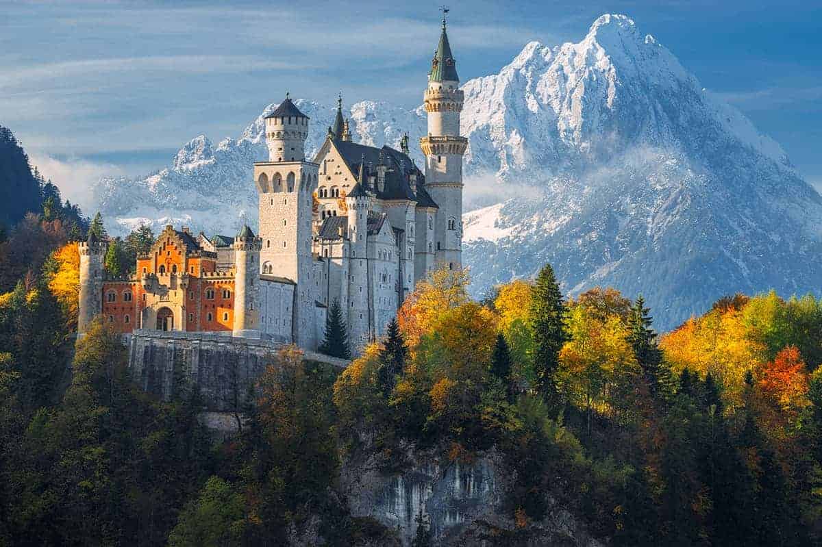 A photo of Neuschwanstein Castle, showing the tall mountains surrounding this site that contribute to horizon shading.